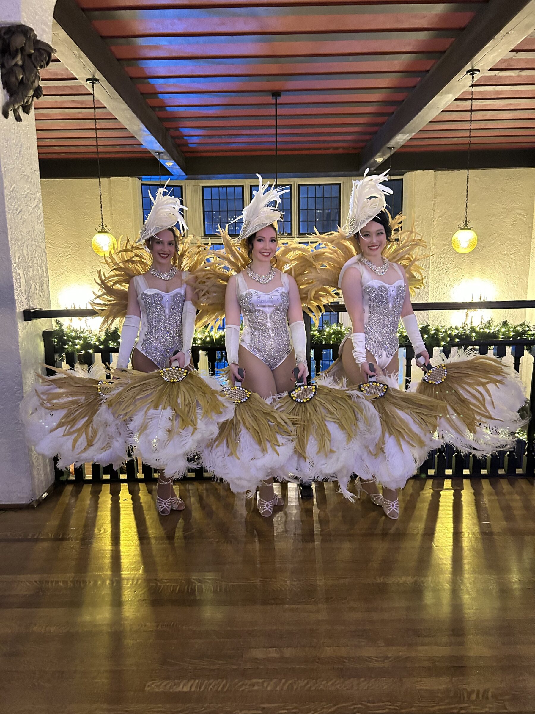 Showgirls in white and gold