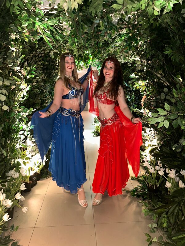 Professional belly dancers performing at a themed event.